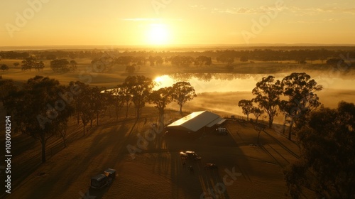 Rural Australian property with a shed at sunrise with fog over a creek photo