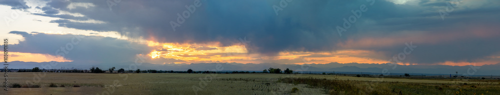 Stormy fall sunset over the prairies and mountains in Aurora, Colorado Stormy fall sunset over the prairies and mountains in Aurora, Colorado