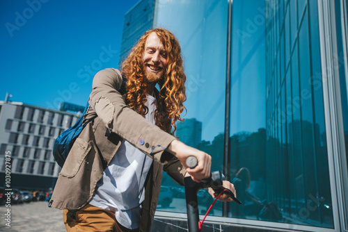 Stylish young man with long red hair and a trendy beard joyfully zips around a vibrant city center on an electric scooter, promoting eco conscious urban transportation