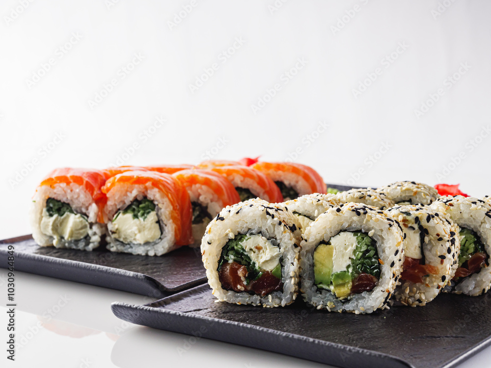 Fresh Sushi Rolls with Salmon and Tuna, Japanese Cuisine on a Gourmet Seafood Plate Fresh Sushi Rolls with Salmon and Tuna, Japanese Cuisine on a Gourmet Seafood Plate