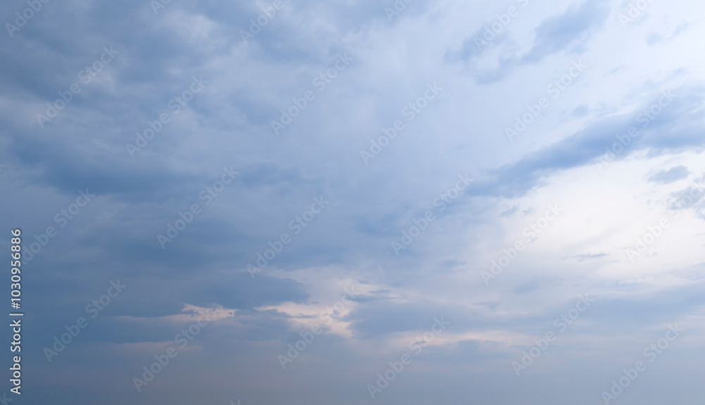 Cloudy sky with a hint of blue peeking through, creating a serene atmosphere. Perfect for backgrounds or nature themes. Cloudy sky with a hint of blue peeking through, creating a serene atmosphere. Perfect for backgrounds or nature themes.