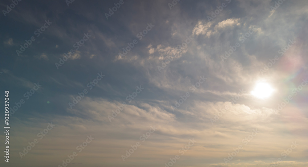 A serene sky with soft, billowy clouds illuminated by the warm sunlight. Perfect for evoking feelings of peace and tranquility. A serene sky with soft, billowy clouds illuminated by the warm sunlight. Perfect for evoking feelings of peace and tranquility.