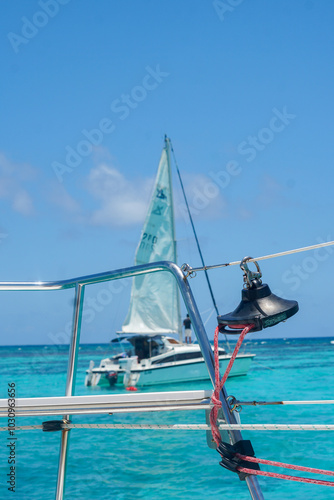 Sail boat by view of yacht