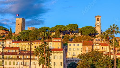 Cannes, France. Panoramic view of the castle and historical buildings of the old town of Cannes at golden hour.