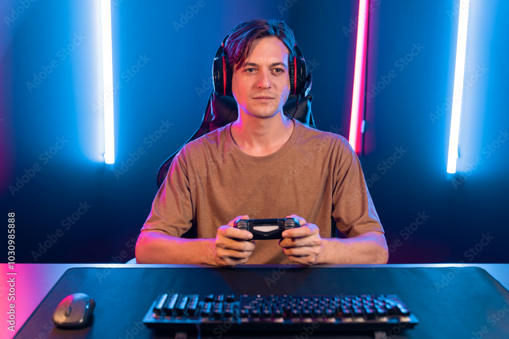 Enjoy smart gaming streamer with control joystick, playing game online of live streaming social media group with team skilled players on computer at modern technology cyber neon light room. Pecuniary. Enjoy smart gaming streamer with control joystick, playing game online of live streaming social media group with team skilled players on computer at modern technology cyber neon light room. Pecuniary.