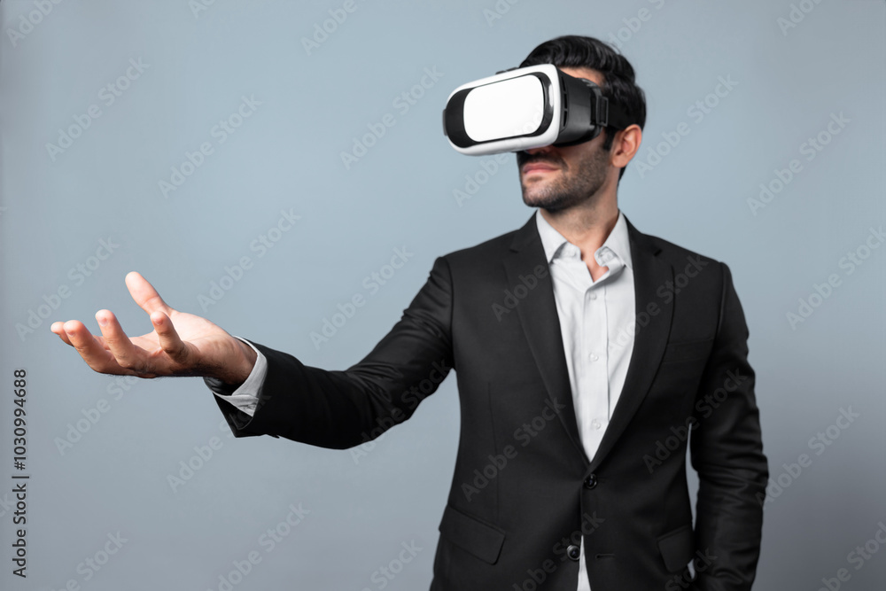 Professional smart business man holding something while wearing VR glasses. Caucasian project manager with virtual reality goggles while present technology innovation with white background. Deviation.