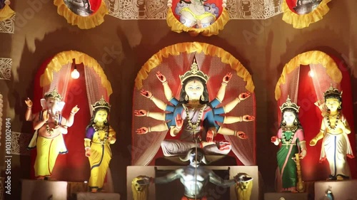 Hindu Goddess Durga idol from Durga Puja pandal known as Durgotsava or Sharodotsav.  Happy Navratri. Bangali Goddess Durga and other goddesses in Pandal. photo