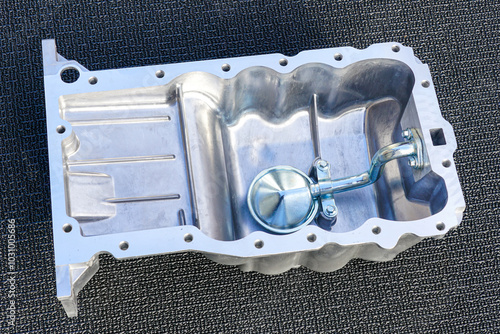 Quadro em tela Passenger car engine new aluminum oil sump with oil receiver tube on gray backgr