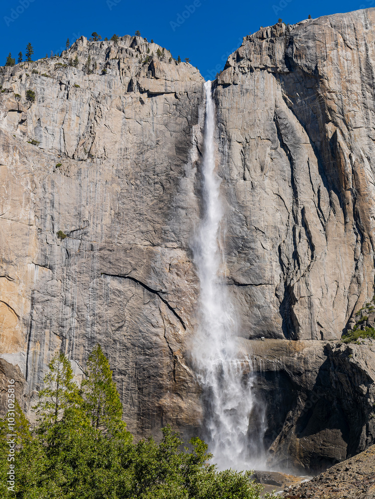 Sunny view of the Upper Yosemite Falls in Yosemite National Park Sunny view of the Upper Yosemite Falls in Yosemite National Park