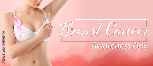 Young woman with pink ribbo...