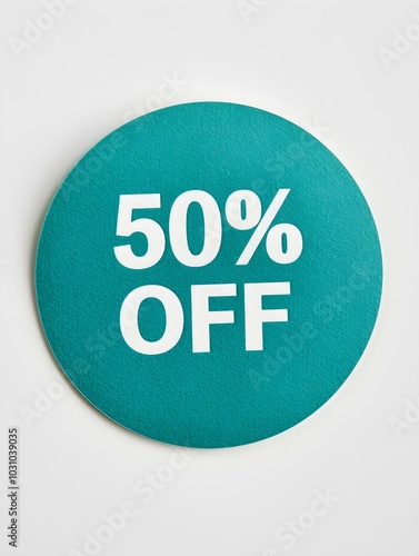 White '50% OFF' Text on a Emerald Round Paper Note. White Background 