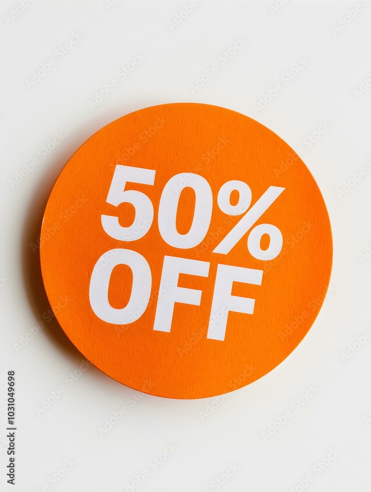White '50% OFF' Text on a Orange Round Paper Note. White Background White '50% OFF' Text on a Orange Round Paper Note. White Background