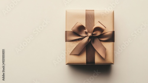 neatly wrapped gift box with a simple ribbon on a white surface, soft natural light, minimalistic composition, , perfect for celebration-themed content and minimalist art.