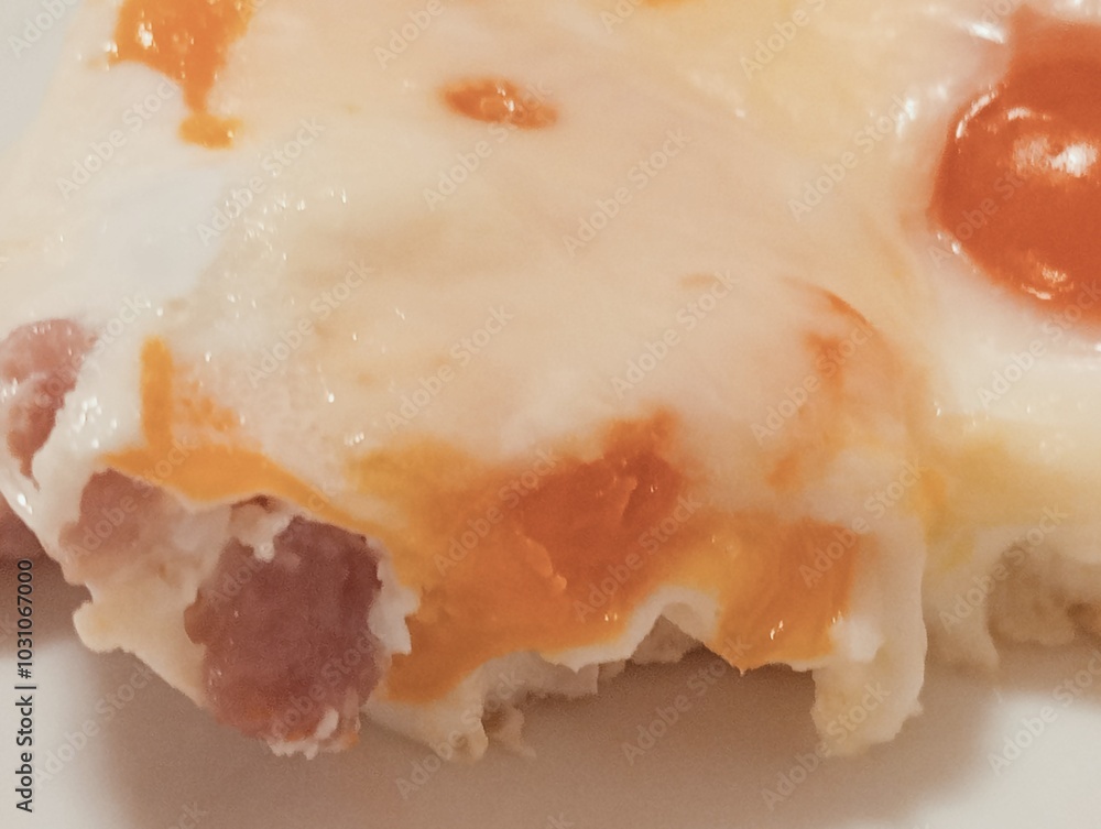 closeup of cooked egg with egg white and yolk