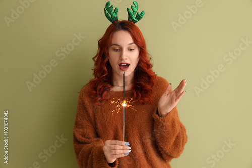 Young woman in reindeer hor...
