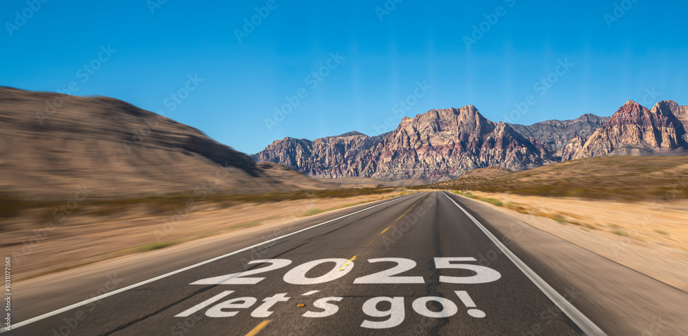 New year 2025 or start straight and beginning concept. Man ride on bike and the number 2025 start written on the road at sunset with lens flare. Concept of challenge or career path, business strategy.