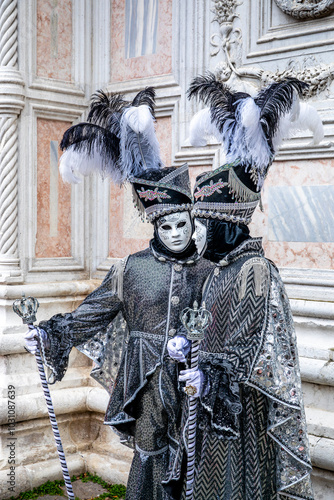 Venice, Italy - February 7, 2024: A couple in carnival costume in Venice, Italy photo