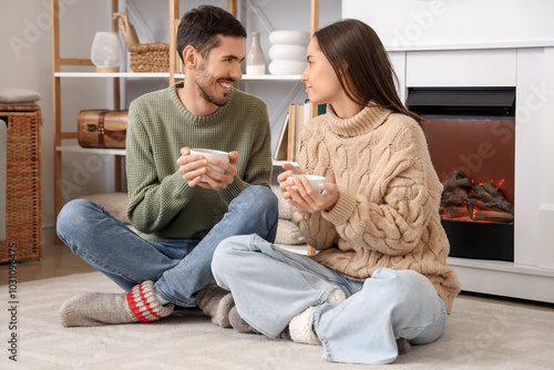 Loving couple with cups of ...