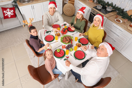 Happy family in Santa hats ...