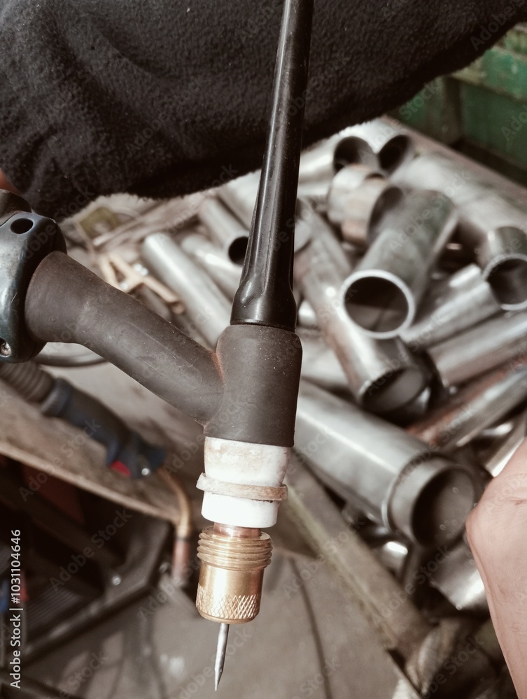 TIG torch spare parts inside a carpentry shop