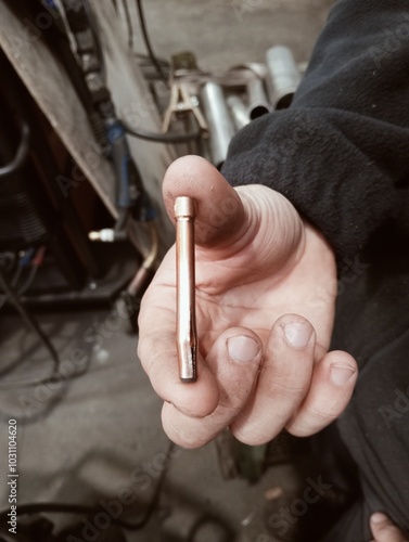 Obraz na płótnie close up of a hand holding a wrench w salonie