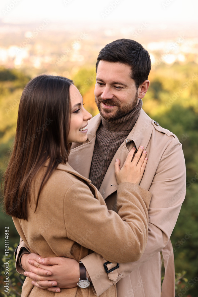 Beautiful couple hugging in park on autumn day Beautiful couple hugging in park on autumn day