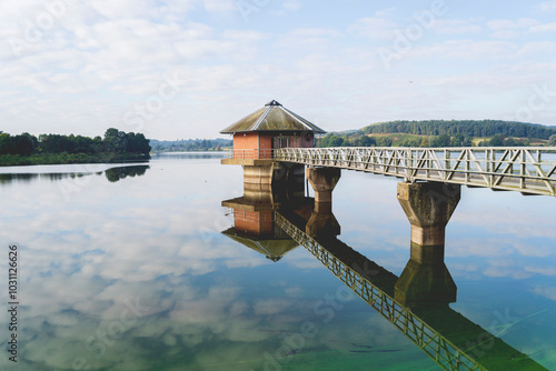 Cropston Reservoir in the morning with mirror lake photo