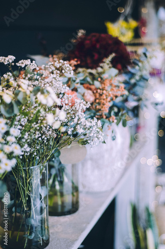 Close up of chic bouquets of seasonal flowers in flower store display