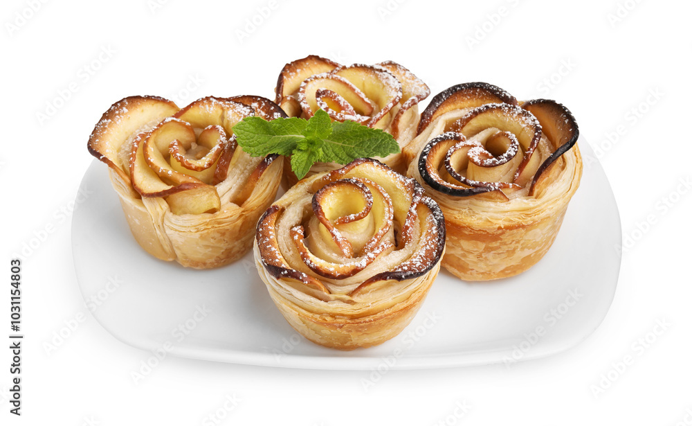 Freshly baked apple roses with mint isolated on white. Puff pastry Freshly baked apple roses with mint isolated on white. Puff pastry