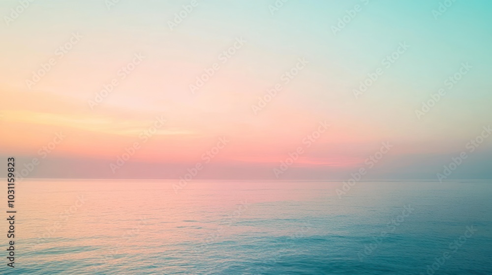A soft, pastel sunrise over a calm ocean with a blurred effect.