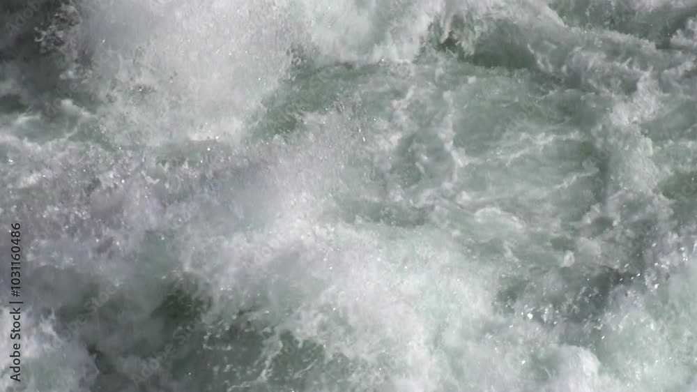 Experience breathtaking beauty of powerful mountain river in Andes, Argentina. Glistening water cascades over jagged rocks, surrounded by majestic landscapes of Patagonia, adventure and exploration. Experience breathtaking beauty of powerful mountain river in Andes, Argentina. Glistening water cascades over jagged rocks, surrounded by majestic landscapes of Patagonia, adventure and exploration.