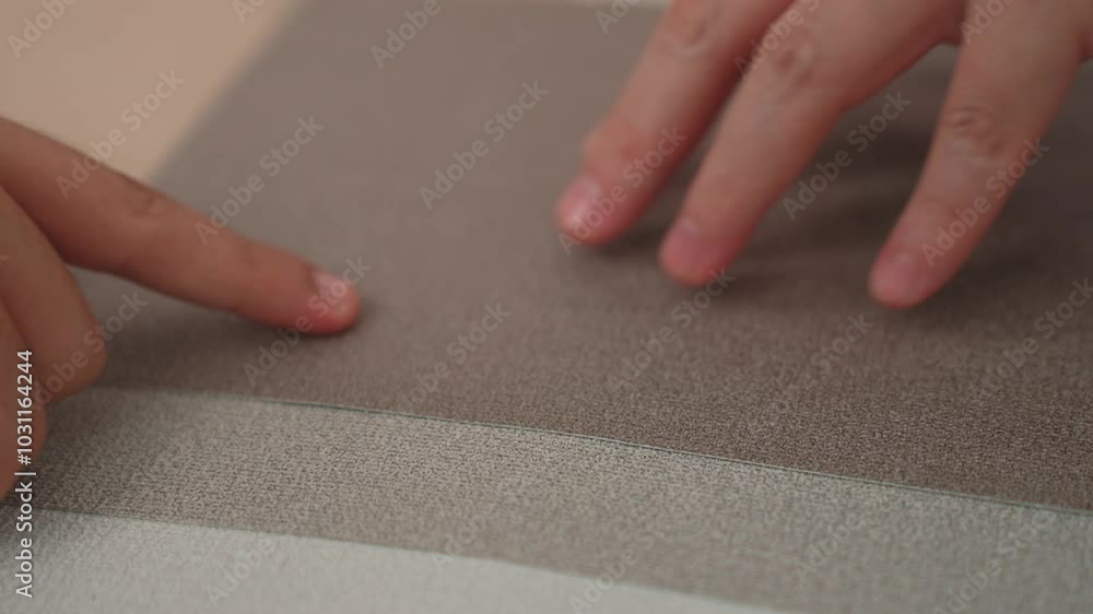 Slow motion hand closeup of professional architect and interior designer presenting material and color from color palette for interior house design based on customer oversee and supervised. Variegated Slow motion hand closeup of professional architect and interior designer presenting material and color from color palette for interior house design based on customer oversee and supervised. Variegated