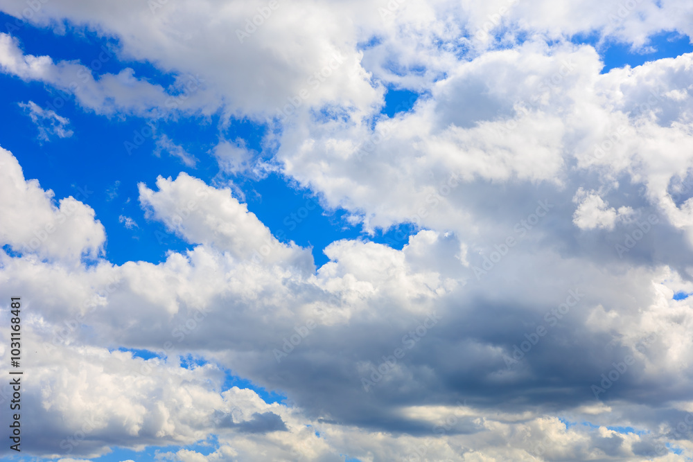 Fototapeta premium The sky is blue with a few clouds scattered throughout, background