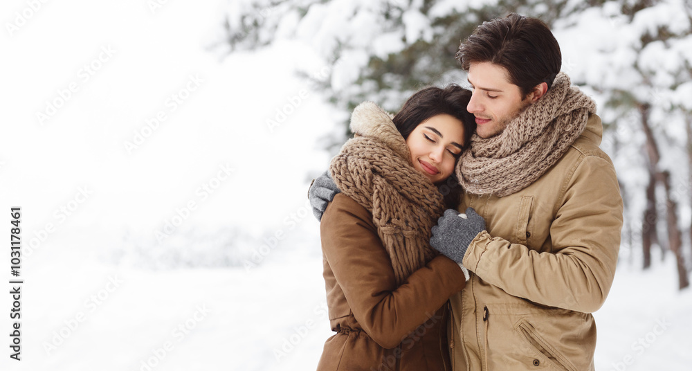Winter Love. Cute Lovers Embracing Standing In Snowy Forest Having Date Outdoor. Copy Space, Panorama Winter Love. Cute Lovers Embracing Standing In Snowy Forest Having Date Outdoor. Copy Space, Panorama