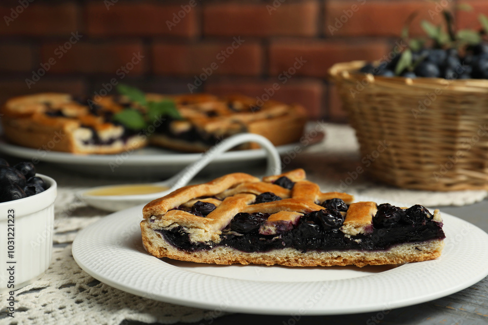 Piece of tasty homemade pie with blueberries on table, closeup Piece of tasty homemade pie with blueberries on table, closeup