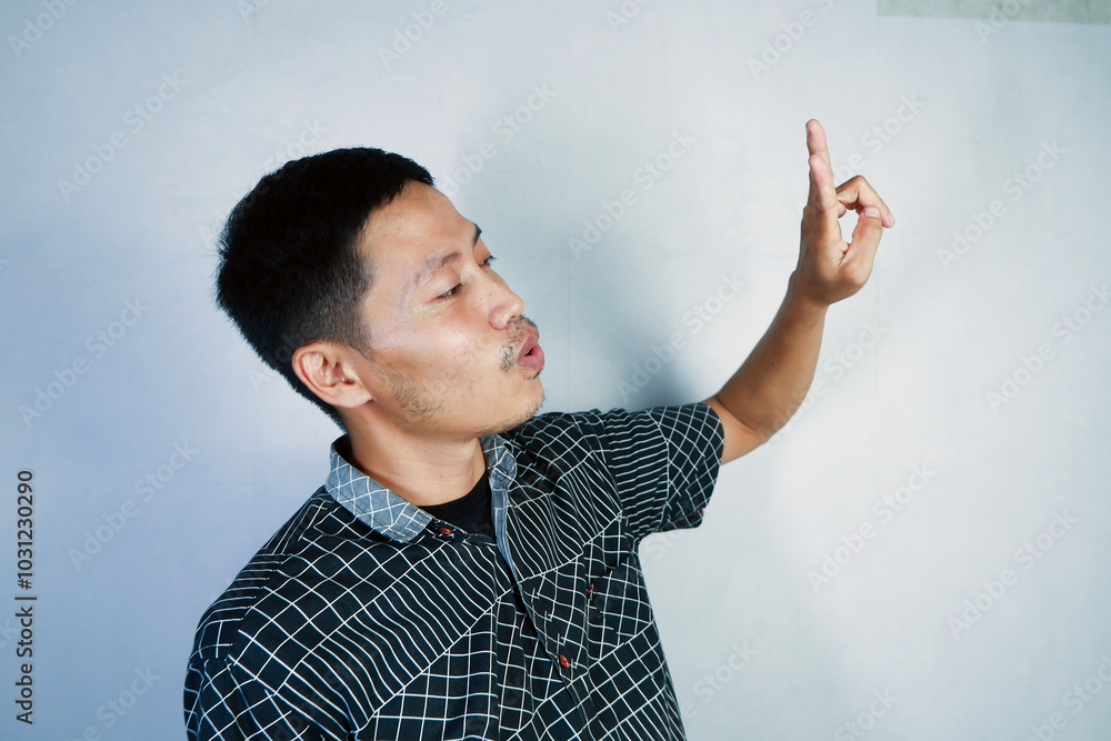 woman in hijab pointing with finger and serious facial expression