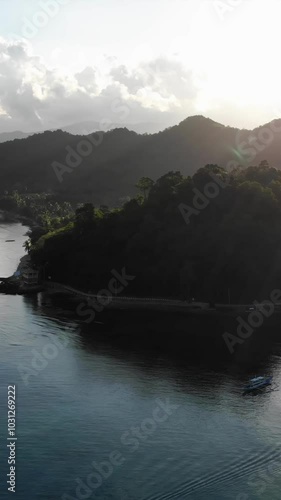 Wallpaper Mural Vertical drone footage captured at sunrise in May showing the city area, islands, mountains, beaches, and boats at El Nido, a hidden paradise and tourist destination in Palawan Island, Philippines. Torontodigital.ca