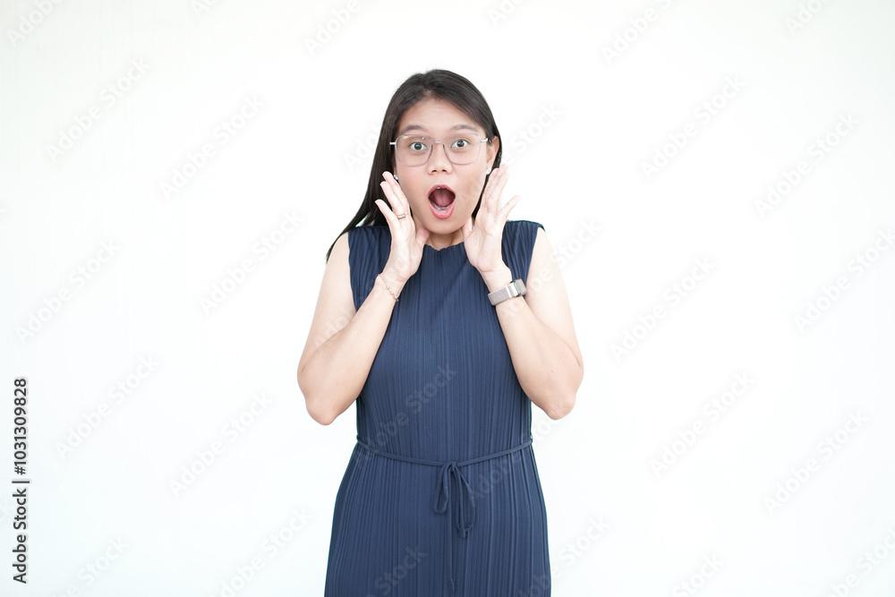 Beautiful Asian woman with wide eyes and open mouth, expressing shock, isolated on a white background Beautiful Asian woman with wide eyes and open mouth, expressing shock, isolated on a white background