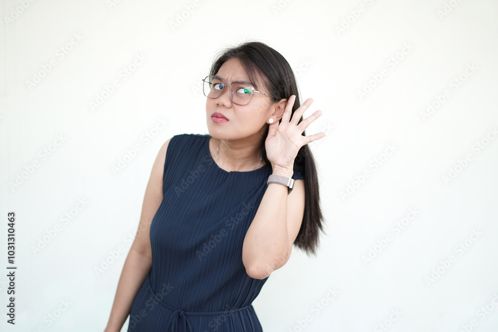 interested woman asks 'What?' struggling to hear a whisper, highlighting her hearing loss. White background interested woman asks 'What?' struggling to hear a whisper, highlighting her hearing loss. White background