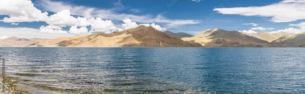 Yamdrok lake in Tibet on a partly cloudy day