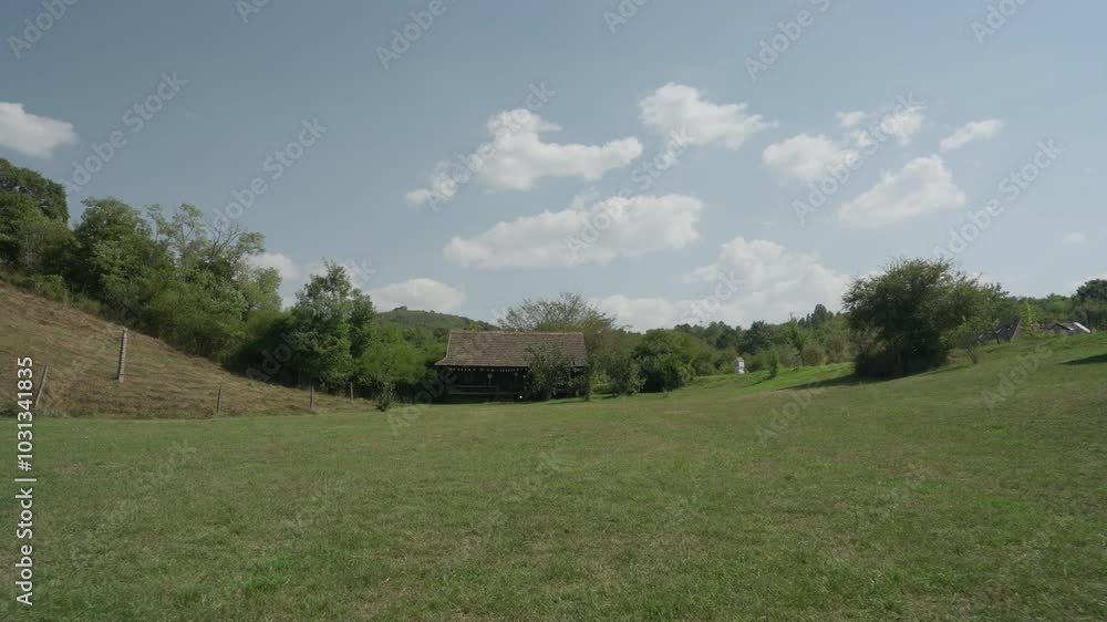 A charming wooden house nestled in nature during a bright summer day, offering a peaceful and serene atmosphere. Perfect for themes of nature, summer, and rustic living. A charming wooden house nestled in nature during a bright summer day, offering a peaceful and serene atmosphere. Perfect for themes of nature, summer, and rustic living.