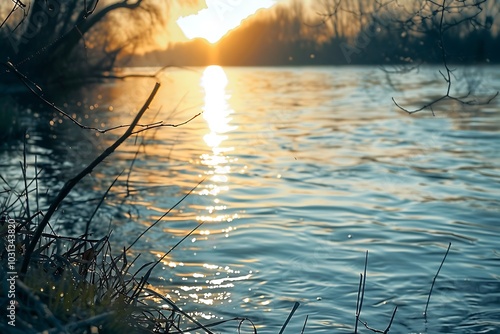 Fototapeta Naklejka Na Ścianę i Meble -  Sunset at the river coast. Sunset on the beach of the Baltic Sea