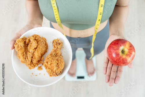 slim body asian women choose healthy foods, dieting female choose red apple for diet. Good healthy food. weight lose, balance, control, reduce fat, low calories, routines, exercise, body shape. photo