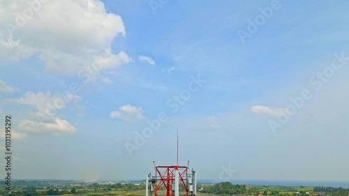 5g High Cell Tower Stands Against a Blue Sky in Rural Area Background. Concept Communication Infrastructure. Aerial View Telecom Tower Antenna and Satellite Transmits Signal of Cellular Mobile 4k
