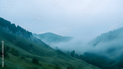 Fog Enveloping Mountain Pass at Dusk