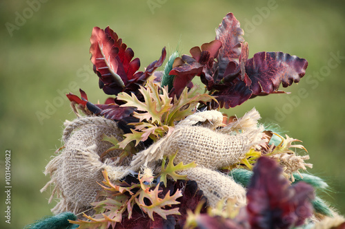 Autumn harvest arrangement with dried flowers and textured fabric