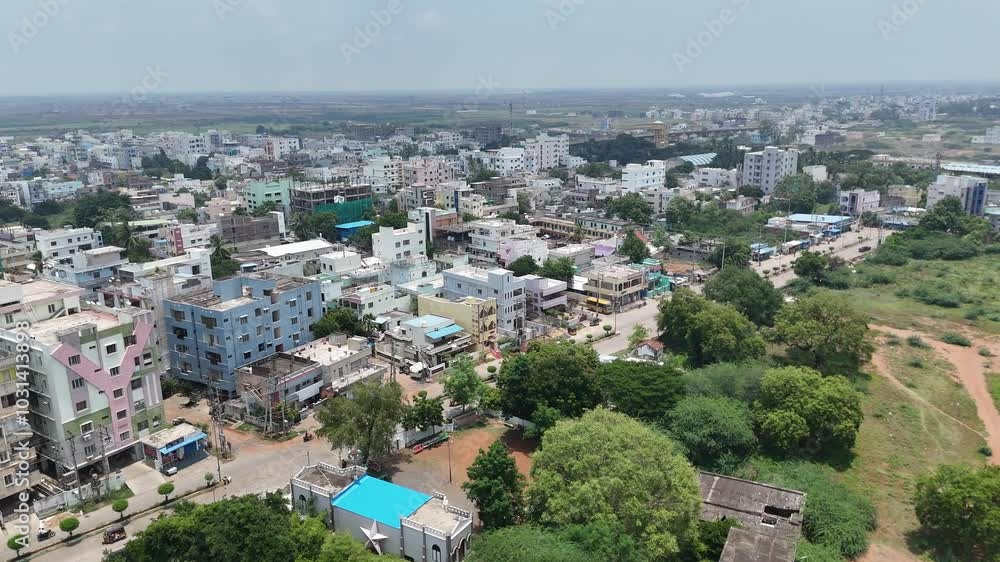 Drone view of a highway stretching through a rural area with buildings. Drone view of a highway stretching through a rural area with buildings.