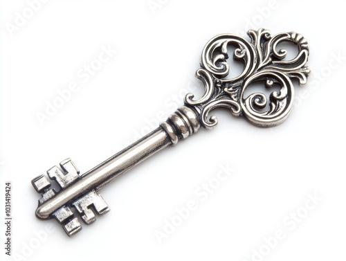 A shiny silver key with detailed cuts, isolated on a white background