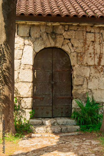 The ancient stone wall is an architectural monument in close-up photo