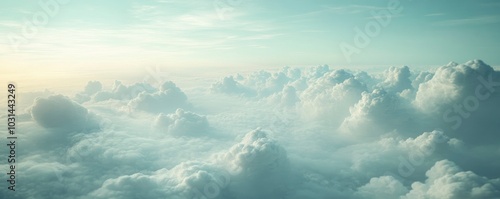 A dreamy skyscape including clouds and soft blue hues.